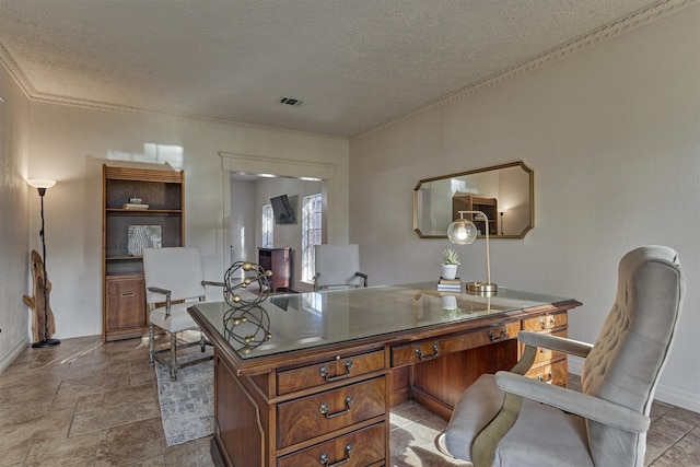 office with a textured ceiling, crown molding, visible vents, and baseboards