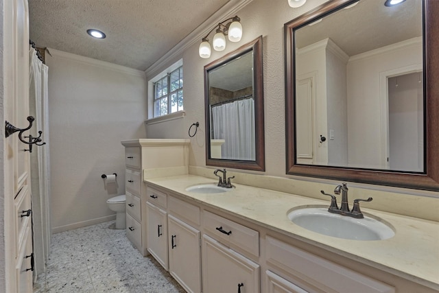 bathroom with crown molding, a sink, and toilet