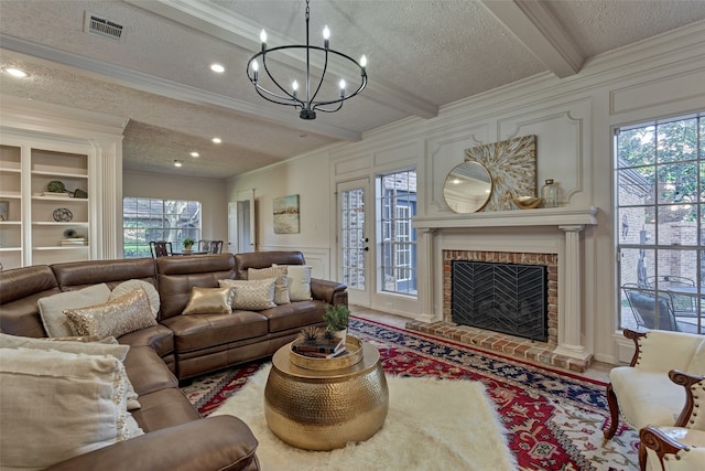 living room featuring crown molding, visible vents, a decorative wall, and beamed ceiling