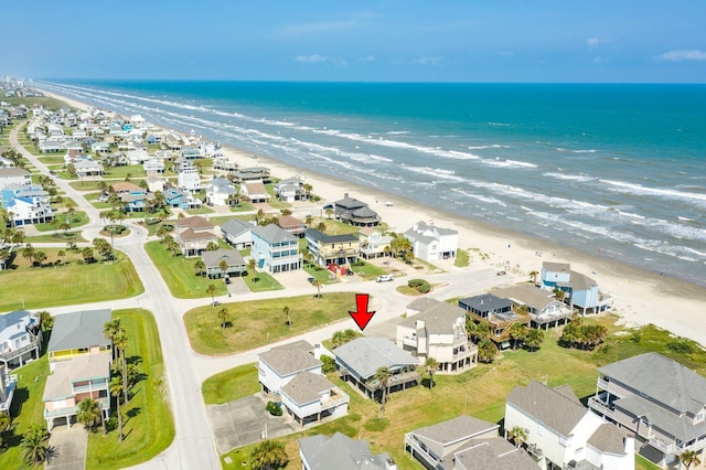 bird's eye view with a beach view, a residential view, and a water view