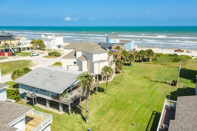 drone / aerial view with a water view and a residential view