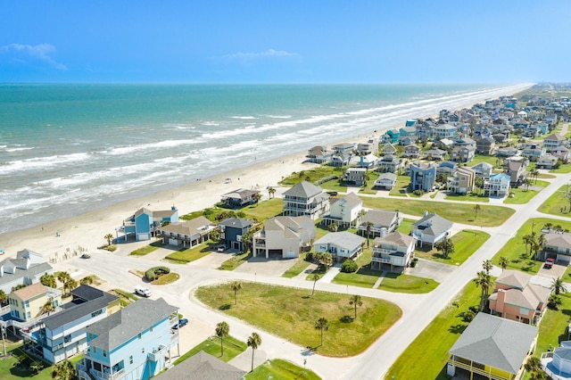 birds eye view of property featuring a residential view, a water view, and a beach view