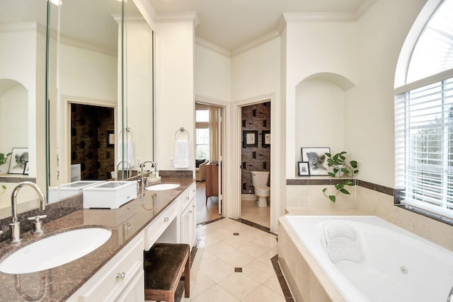 bathroom featuring toilet, ornamental molding, a sink, and tile patterned floors