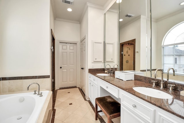 bathroom featuring a garden tub, visible vents, a sink, and ornamental molding