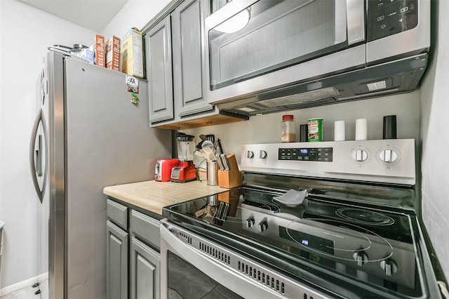 kitchen with light countertops, appliances with stainless steel finishes, and gray cabinets