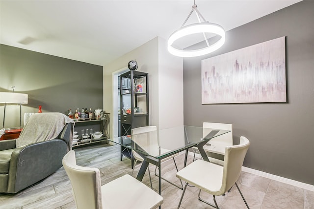 dining room with baseboards