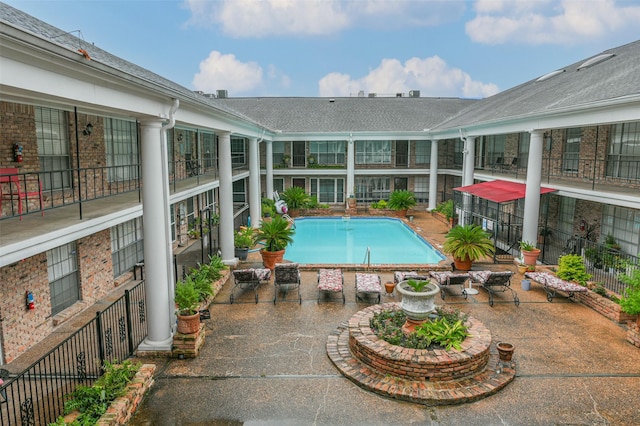 outdoor pool featuring a patio