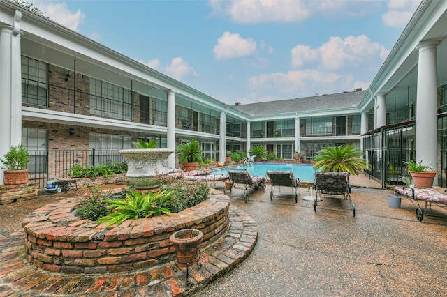 exterior space featuring an outdoor pool