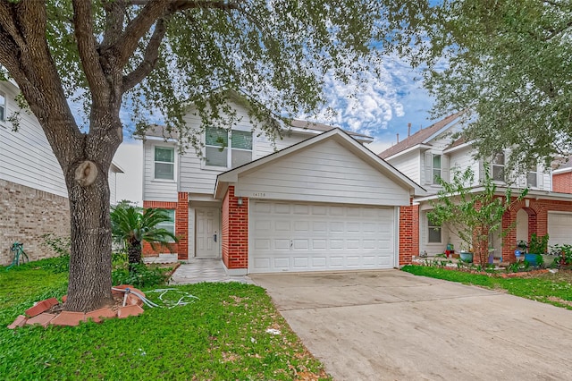 traditional home featuring a garage, concrete driveway, and brick siding