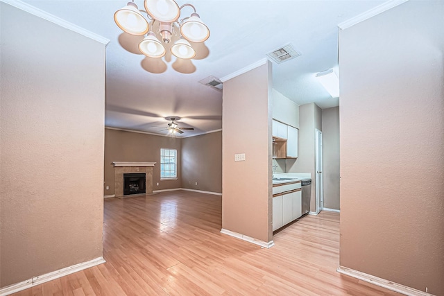 kitchen featuring ornamental molding, stainless steel dishwasher, visible vents, and white cabinetry