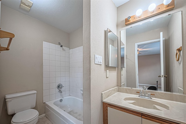 bathroom featuring tile patterned flooring, toilet, visible vents, vanity, and washtub / shower combination