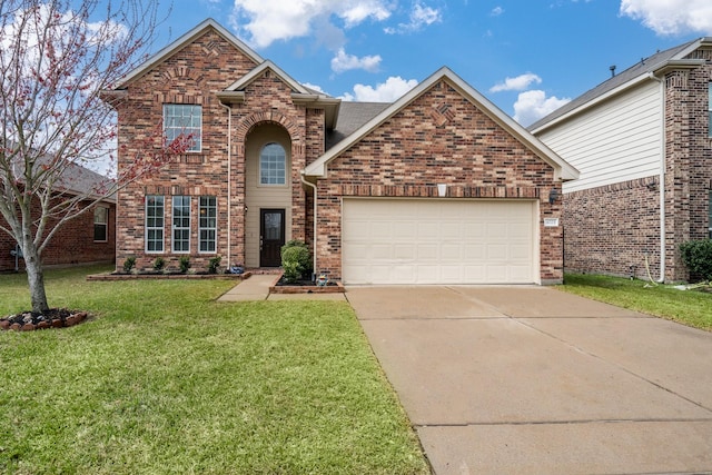 traditional-style home featuring concrete driveway, an attached garage, and brick siding