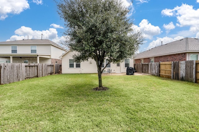 view of yard with a patio area and a fenced backyard