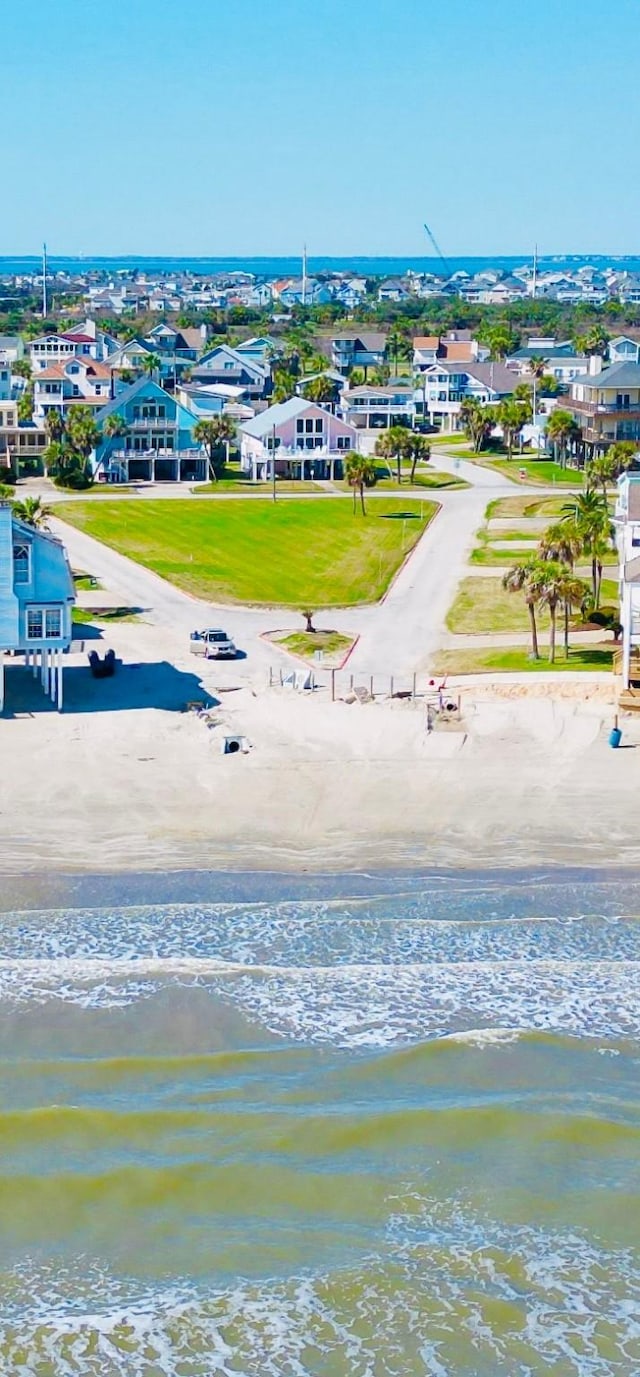 drone / aerial view featuring a residential view and a water view
