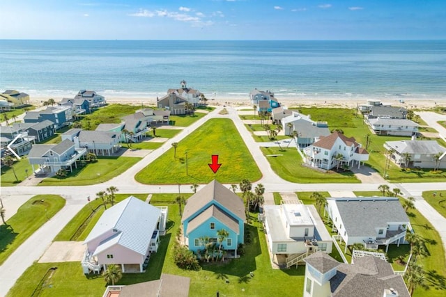 drone / aerial view with a water view and a residential view