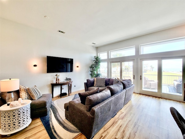 living room with visible vents and light wood finished floors