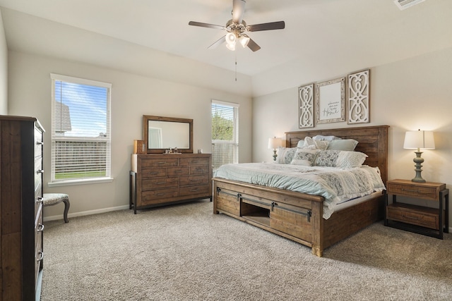 carpeted bedroom with visible vents, baseboards, and ceiling fan