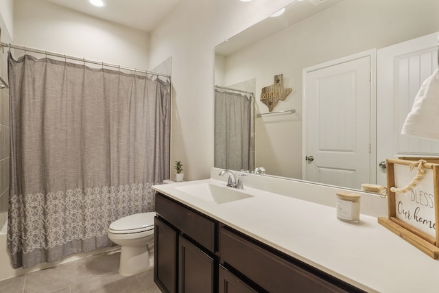 full bath featuring vanity, shower / bath combo with shower curtain, tile patterned flooring, and toilet