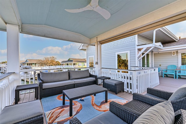 view of patio / terrace with outdoor lounge area, a ceiling fan, and a wooden deck