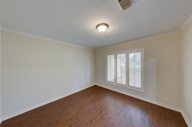 unfurnished room with baseboards, crown molding, visible vents, and dark wood-type flooring