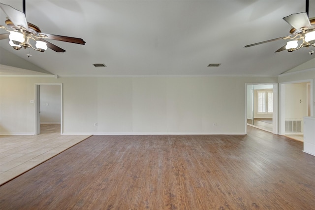 unfurnished living room with visible vents, wood finished floors, and ornamental molding