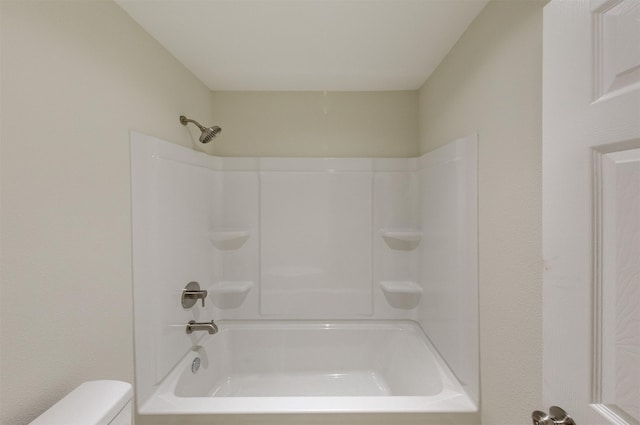 bathroom with walk in shower and toilet