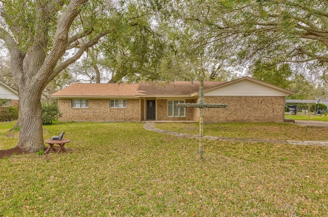 ranch-style home with brick siding and a front lawn