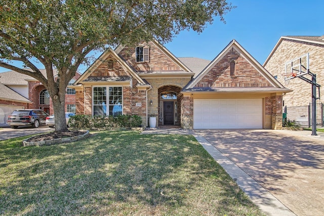 traditional-style house featuring brick siding, an attached garage, concrete driveway, and a front yard