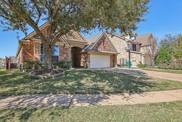 view of front of property with brick siding, an attached garage, driveway, and a front lawn