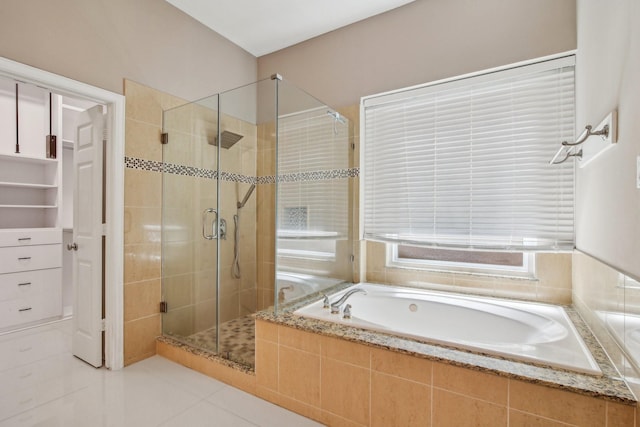 full bath with a bath, tile patterned flooring, and a stall shower