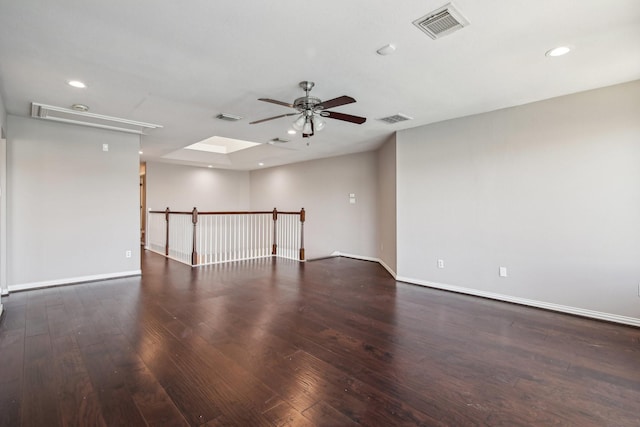 empty room with recessed lighting, wood finished floors, and visible vents