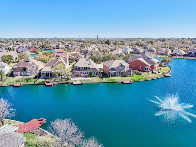 aerial view with a residential view and a water view