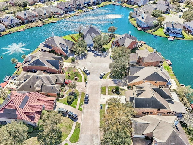 birds eye view of property with a residential view and a water view