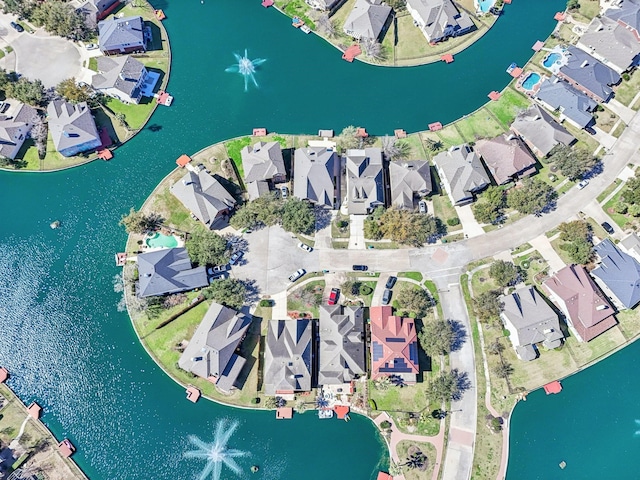 birds eye view of property featuring a residential view and a water view