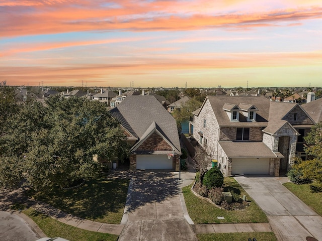 view of front of home with a residential view and concrete driveway