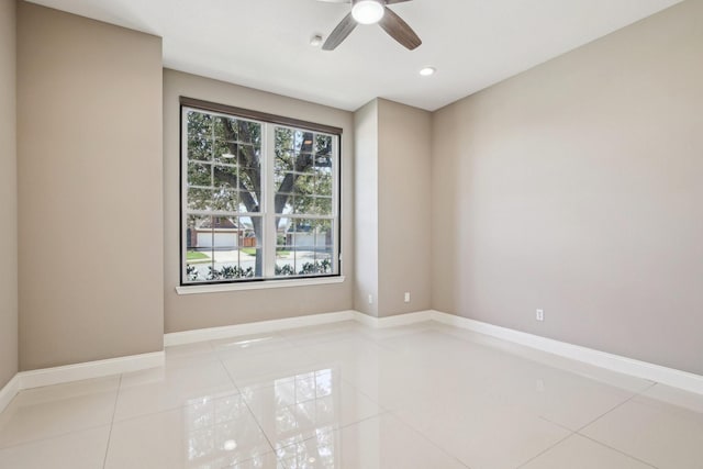 unfurnished room featuring light tile patterned floors, recessed lighting, a ceiling fan, and baseboards