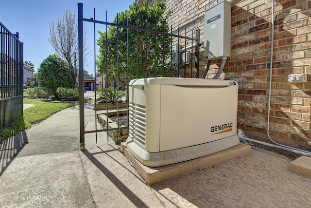 exterior details with a power unit and brick siding