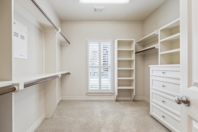 spacious closet featuring light carpet and visible vents