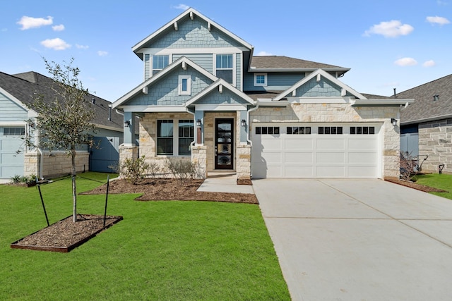 craftsman inspired home featuring driveway, a front lawn, and stone siding