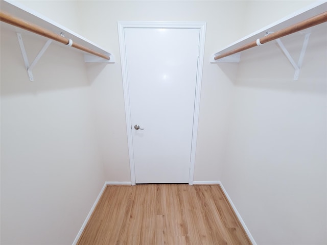 spacious closet with light wood-style floors