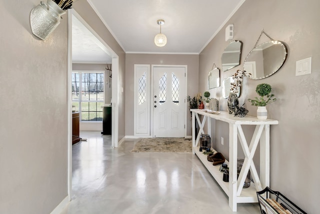 entryway featuring baseboards, crown molding, and finished concrete floors