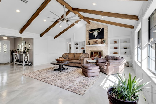 living area with built in features, a decorative wall, a brick fireplace, high vaulted ceiling, and beamed ceiling