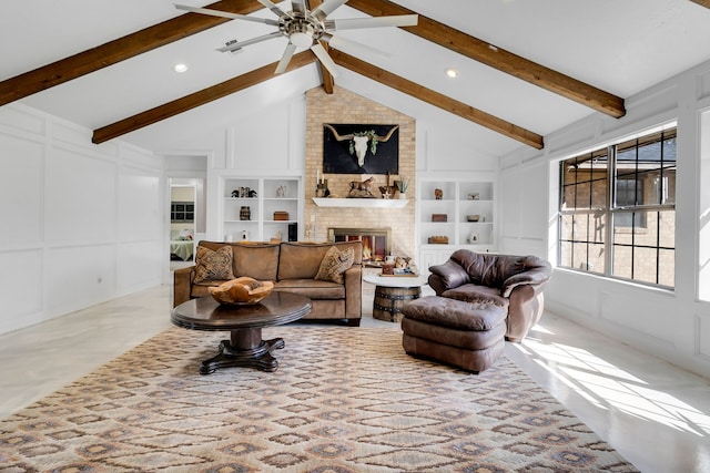 living area with a fireplace, built in features, a decorative wall, and beamed ceiling