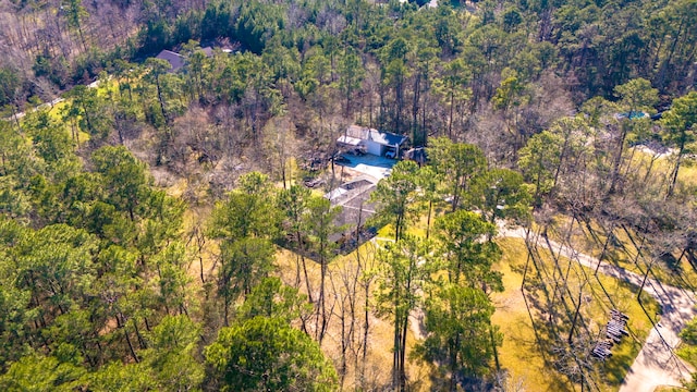 drone / aerial view featuring a forest view