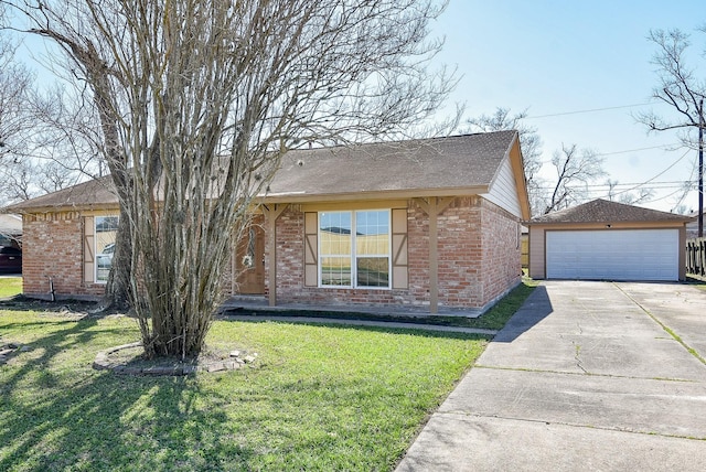 single story home with a garage, a front yard, an outbuilding, and brick siding