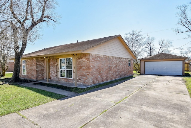 view of home's exterior with a garage, brick siding, an outdoor structure, and a lawn