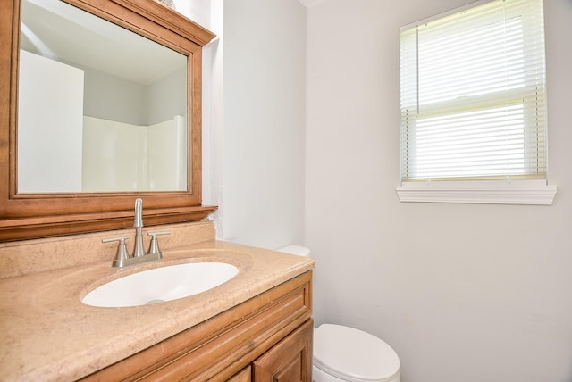 bathroom with vanity and toilet