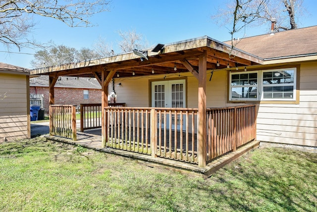 rear view of house featuring a shingled roof, french doors, a lawn, and a wooden deck