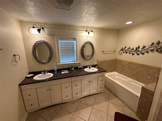 full bathroom with a textured wall and a sink