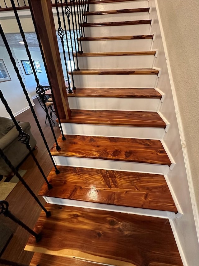 stairs with wood finished floors